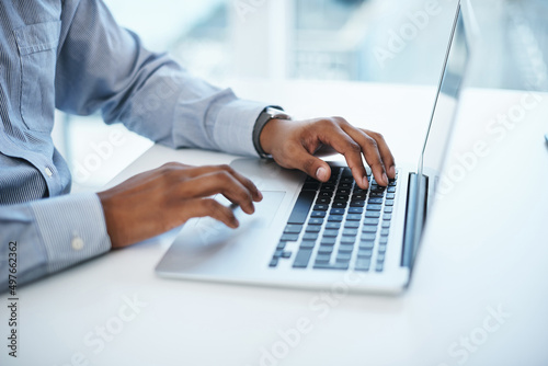 A good fibre connection produces good work. Shot of a businessman using a computer in a modern office.