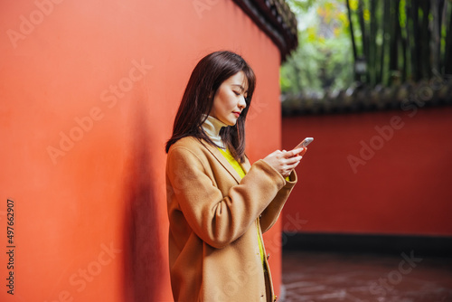 Asian woman using a phone