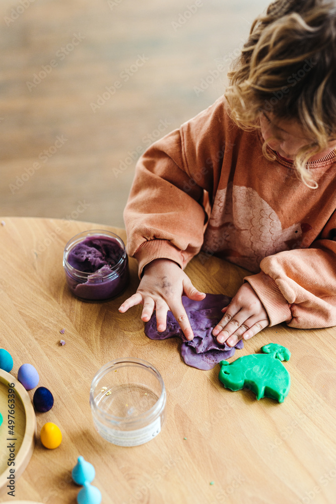 Kids playing with play dough indoors Stock Photo | Adobe Stock