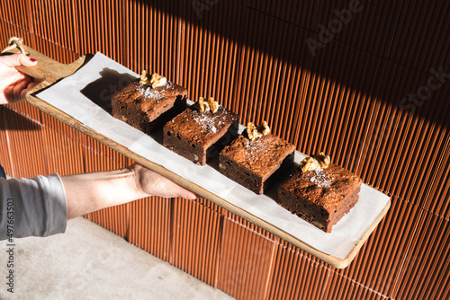 Baker with freshly baked brownie