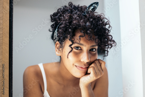latin young woman with curly hair