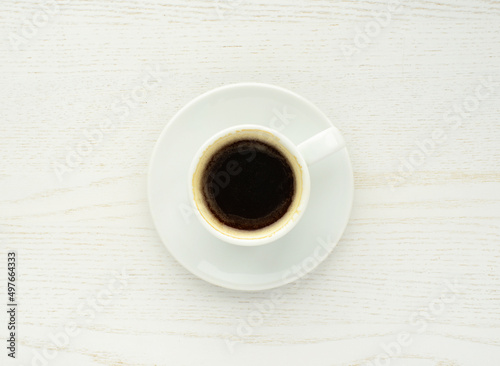Coffee cup, top view . Coffee cup ona white wooden table. Espresso, hot fresh black coffee