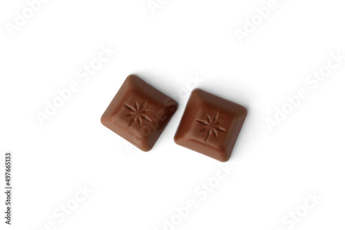 Chocolate pieces with strawberry filling isolated on white background.