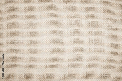 Jute hessian sackcloth burlap canvas woven texture background pattern in light beige cream brown color design element.