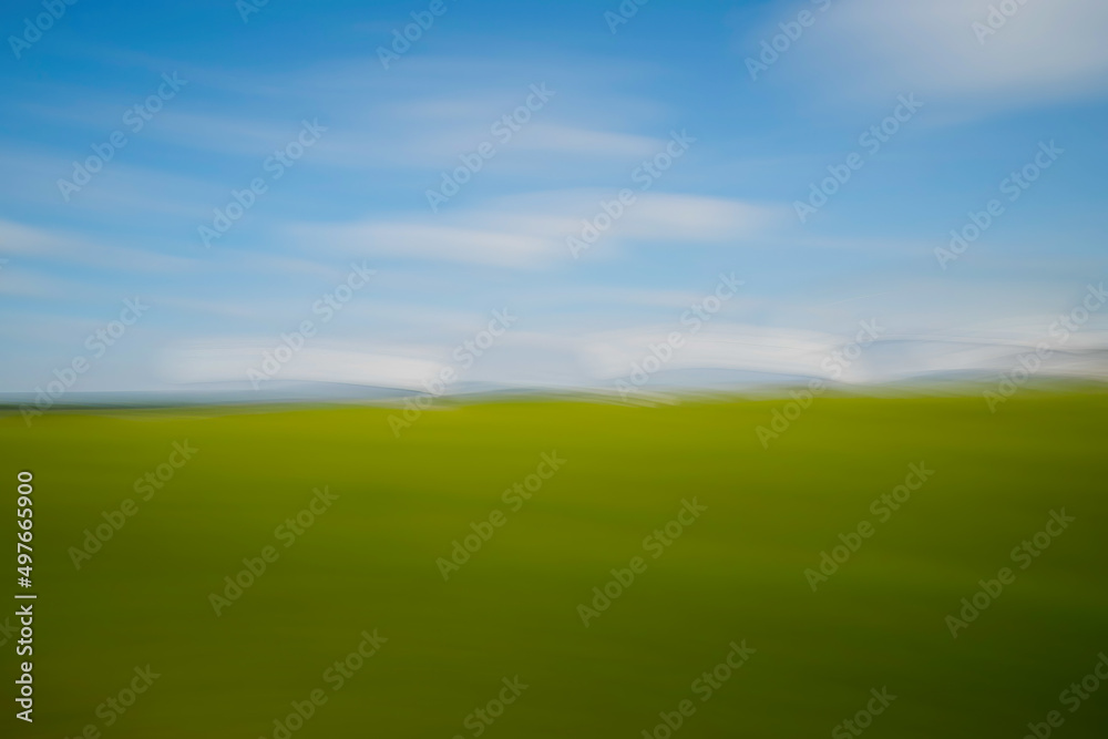 blurry background with a landscape in motion