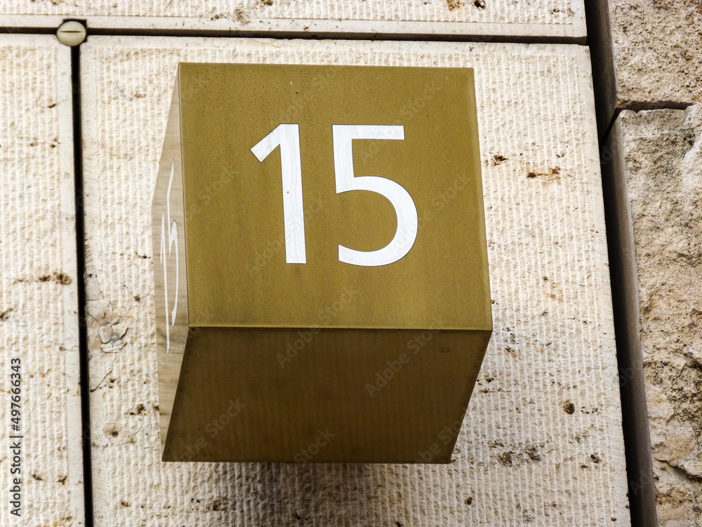 Metal home number on a wall