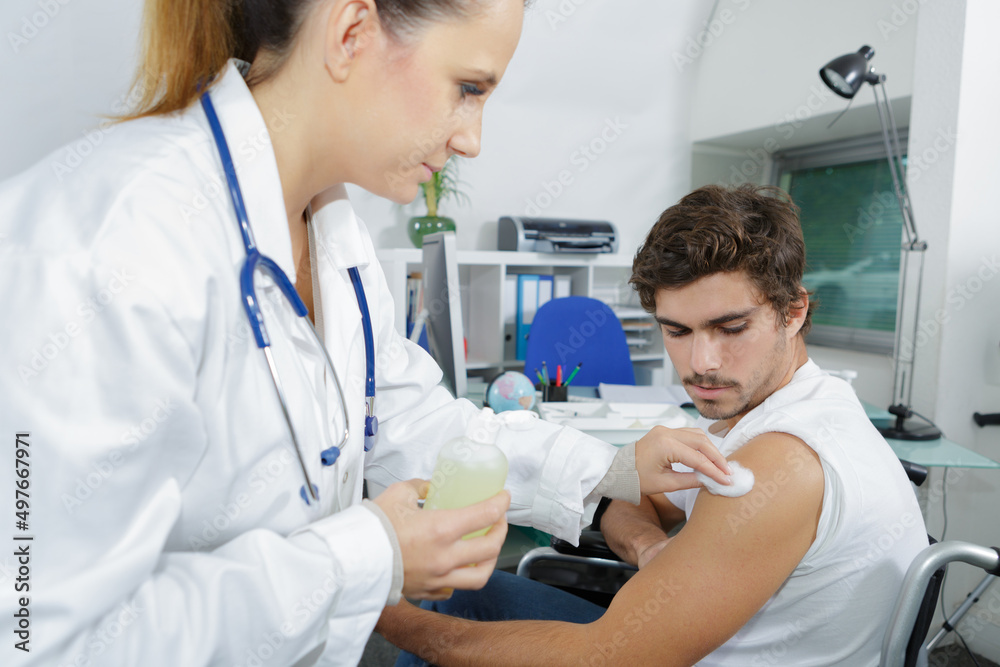 doctor in protective gloves making woman an injection doctor in protective gloves making woman an injection