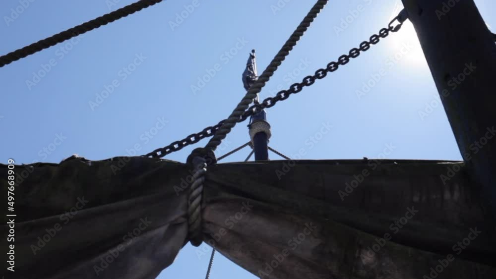 Crow's nest and sails on a pirate ship sailing at sea. Ropes and a a ...