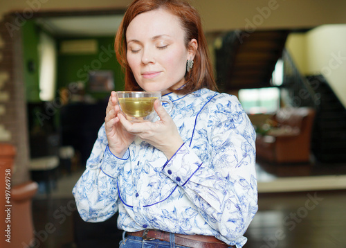 person drinking coffee. Woman with mug in the morning. Have a break. 
