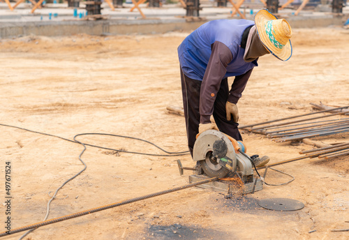 Worker use electric circular steel cutting machine and sparkle