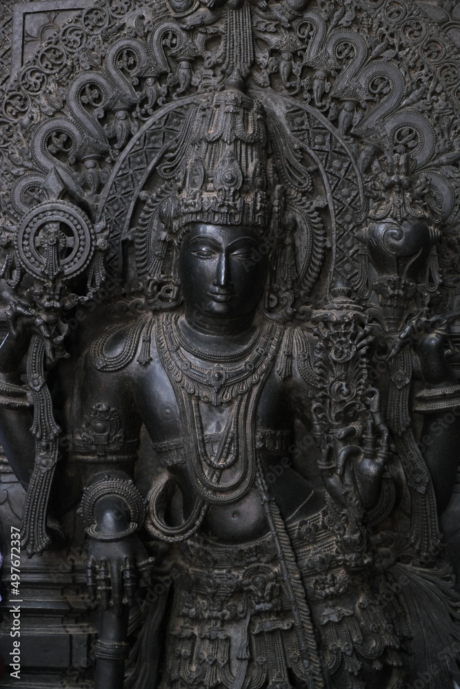 Stone Sculpture of  Hindu Gods with selective focus, 12th century Hindu temple, Ancient stone art and sculptures in each pillars, Chennakeshava Temple, Belur, Karnataka, India.