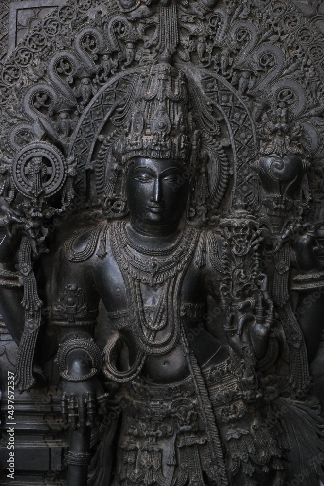 Stone Sculpture of Hindu Gods with selective focus, 12th century Hindu temple, Ancient stone art and sculptures in each pillars, Chennakeshava Temple, Belur, Karnataka, India. Stone Sculpture of Hindu Gods with selective focus, 12th century Hindu temple, Ancient stone art and sculptures in each pillars, Chennakeshava Temple, Belur, Karnataka, India.