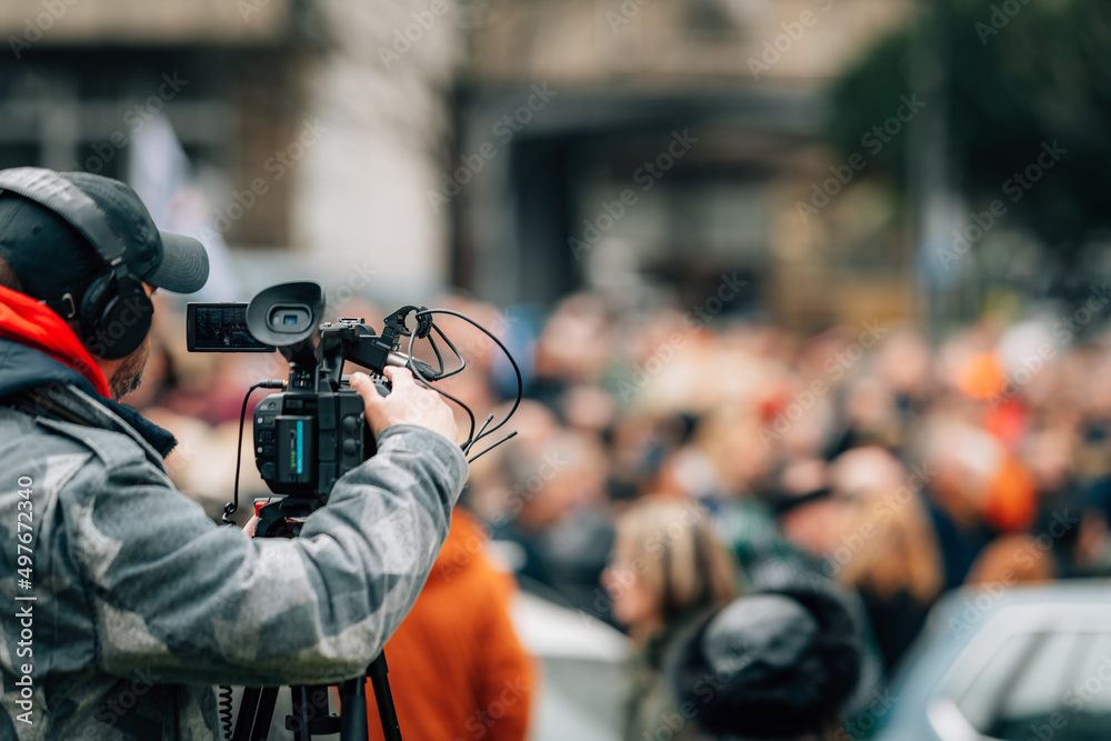 Making news, media cameraman at a public protest Making news, media cameraman at a public protest