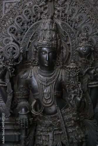 Stone Sculpture of  Hindu Gods with selective focus, 12th century Hindu temple, Ancient stone art and sculptures in each pillars, Chennakeshava Temple, Belur, Karnataka, India.