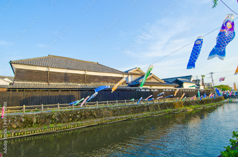The Japanese Carp Fish Flags at The storehouses along the shore of the Uzumagawa River in Tochigi town.The Japanese letters means The History and Legend of Togichi town. The Japanese Carp Fish Flags at The storehouses along the shore of the Uzumagawa River in Tochigi town.The Japanese letters means The History and Legend of Togichi town.