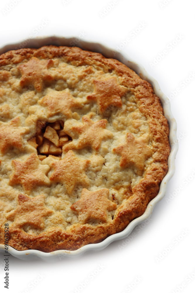 Apple Pie with double crust with cinnamon made with shortcrust pastry isolated on white background with star shape decoration Apple Pie with double crust with cinnamon made with shortcrust pastry isolated on white background with star shape decoration