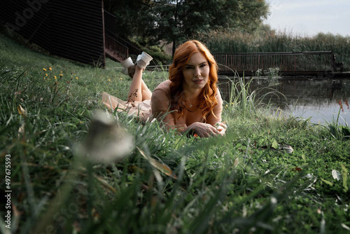 girl in a transparent dress walking along the river bank of the city of Lipetsk photo