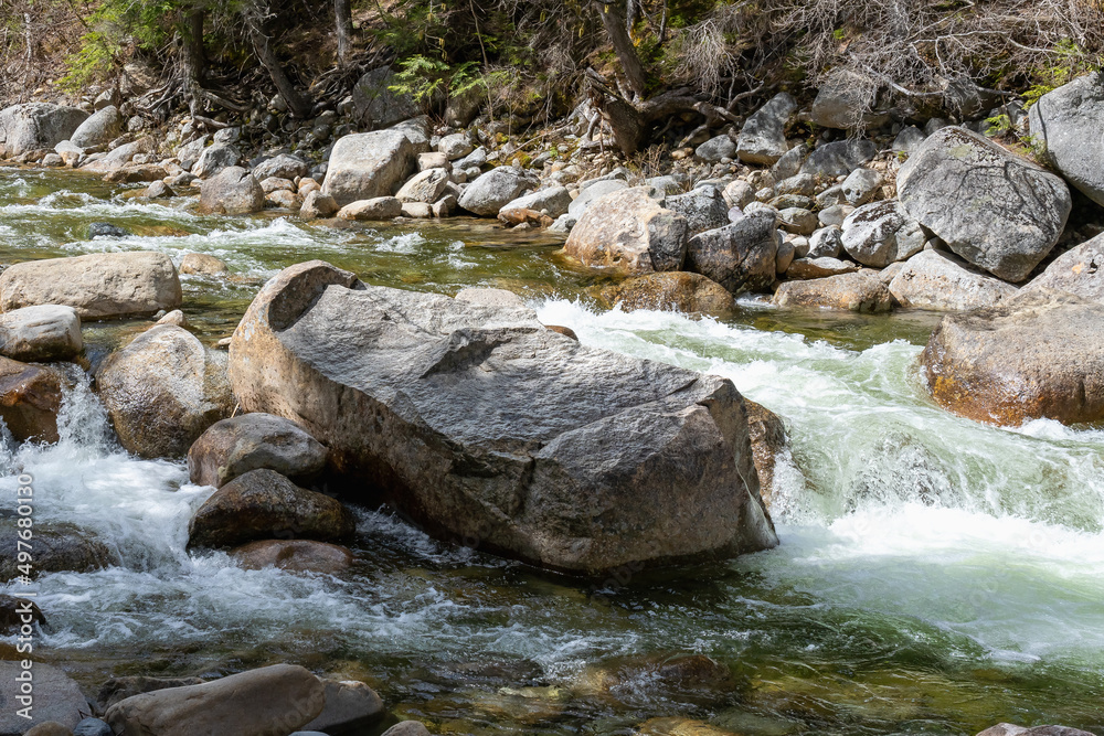 Mountain river among stones in spring in the White Mountains, New Hampshire, USA Mountain river among stones in spring in the White Mountains, New Hampshire, USA