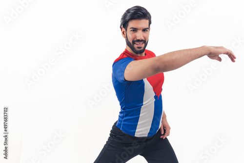 let's start dancing - bearded Latin American man in T-shirt of Cuban flag making dance element on white background studio shot isolated copy space cowboy shot. High quality photo
