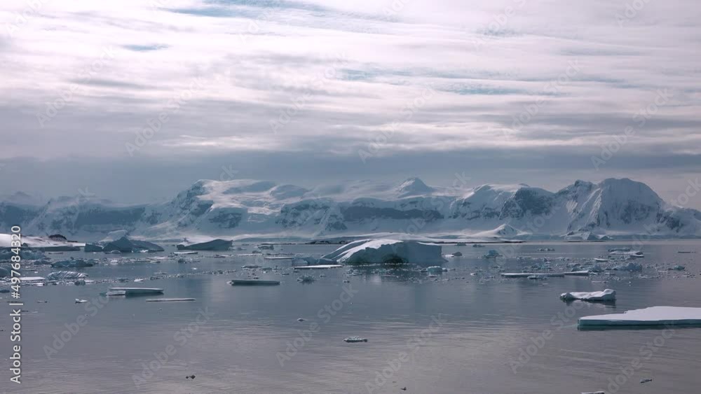 Reflection of mountains and icebergs in the water Reflection of mountains and icebergs in the water