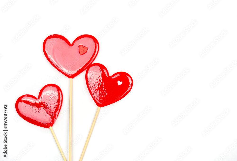 Lollipops hearts on white background. Congratulations, space for text.