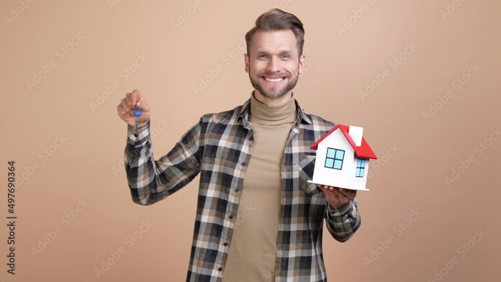 Broker guy hold house keys recommend settlement isolated pastel color background Broker guy hold house keys recommend settlement isolated pastel color background
