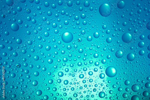  water drops over blue background.
