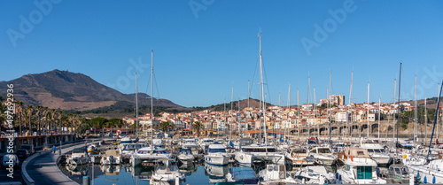 Mountains of the Massif des Albères behind the port and village of Banyuls-sur-Mer photo