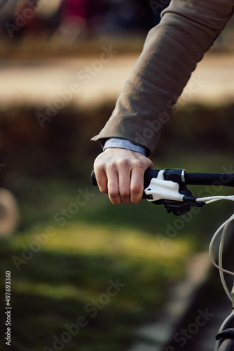 The male person holding a bicycle handlebar