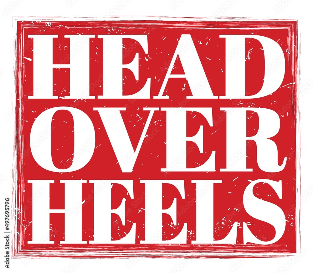 HEAD OVER HEELS, text on red stamp sign HEAD OVER HEELS, text on red stamp sign
