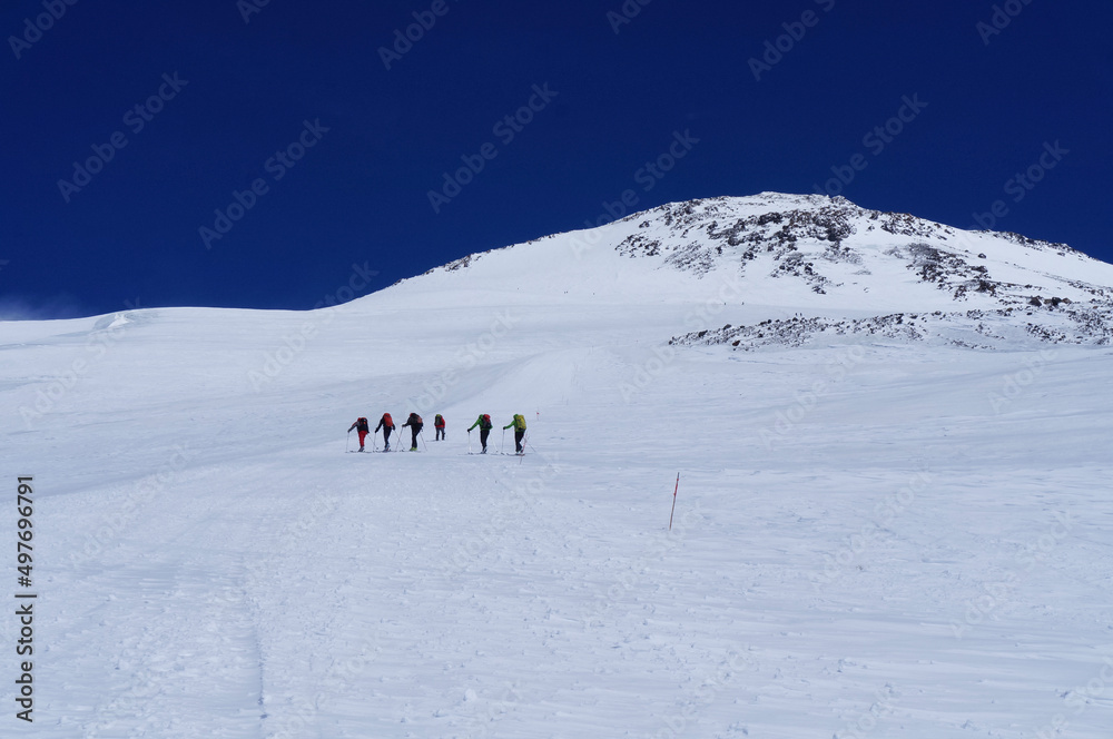 Group of hikers climbing in snow mountain Elbrus