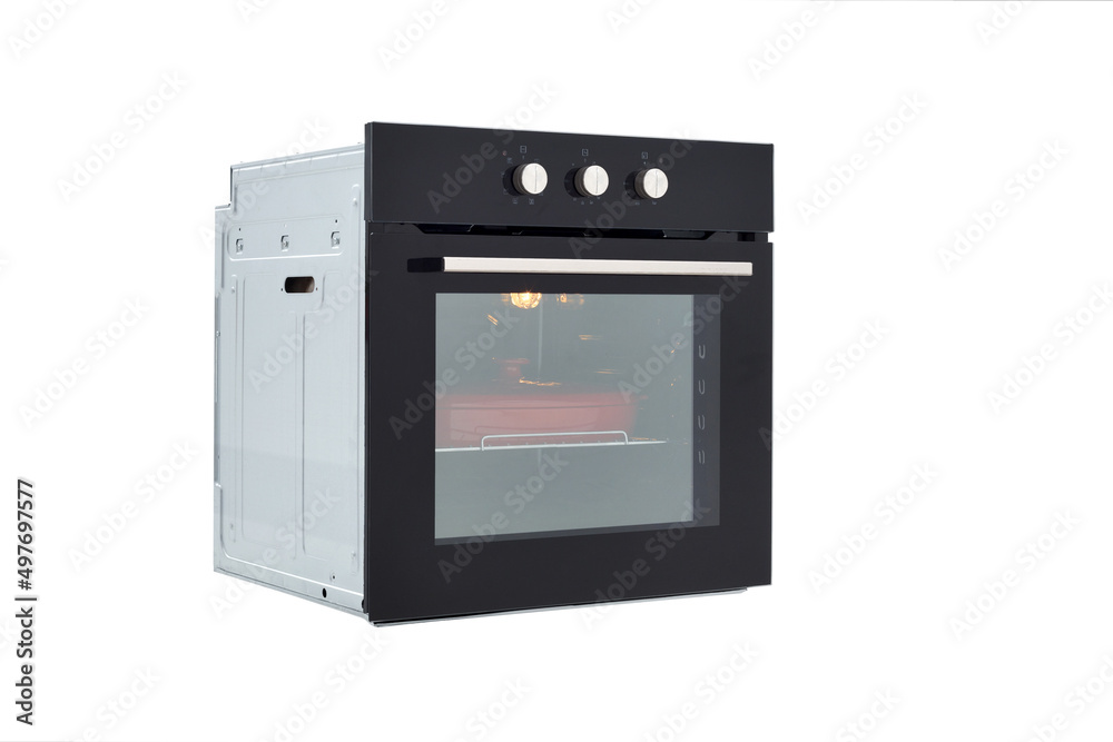 Black oven with closed door and red baking dish, 45 degree view, isolated on white Black oven with closed door and red baking dish, 45 degree view, isolated on white