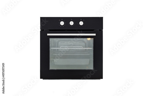 Black oven with closed door and three baking sheets, front view, isolate on white