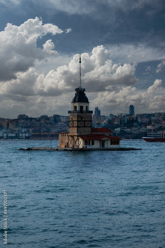 Maiden's Tower on background cloudy sea. Maiden's Tower or Kiz Kulesi located in the middle of Bosphorus, Istanbul in Turkey. 