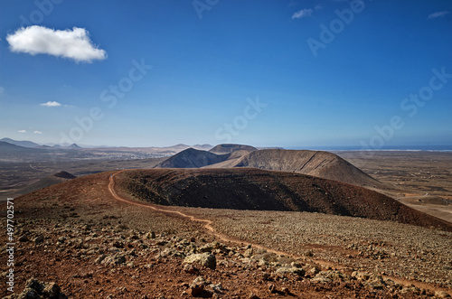 View from the top of volcano in Fuerteventura. Famous Volcanes de Bayuyo. Hiking in Canary Islands.