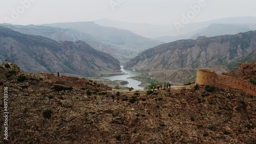 Aerial view of the Ruins of Imam Shamil's fortress. Landscape of a mountain valley. The attraction of Dagestan. Famous landmark. Ancient settlement. Travel in Russia. 4K10 bit Video photo