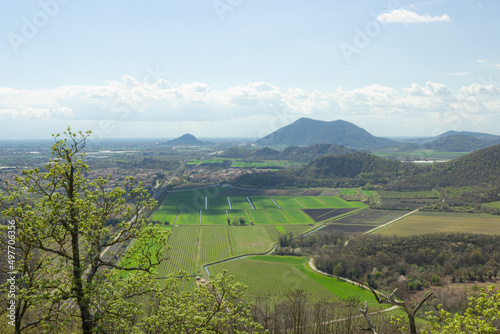Hilly landscape. Trail on Monte Ceva. Aerial view of the Terme Euganee, Padua and the cultivated fields. Green spring landscape.