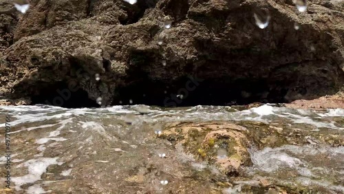 Water flowing over rocks. 