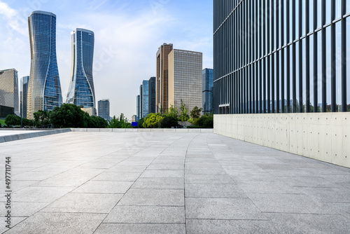 Empty square floor and city skyline with modern commercial buildings in Hangzhou, China. © ABCDstock