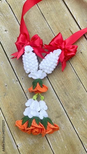 Selective focusing Thaigarlandflowers crochet in handmade concept On wooden background 