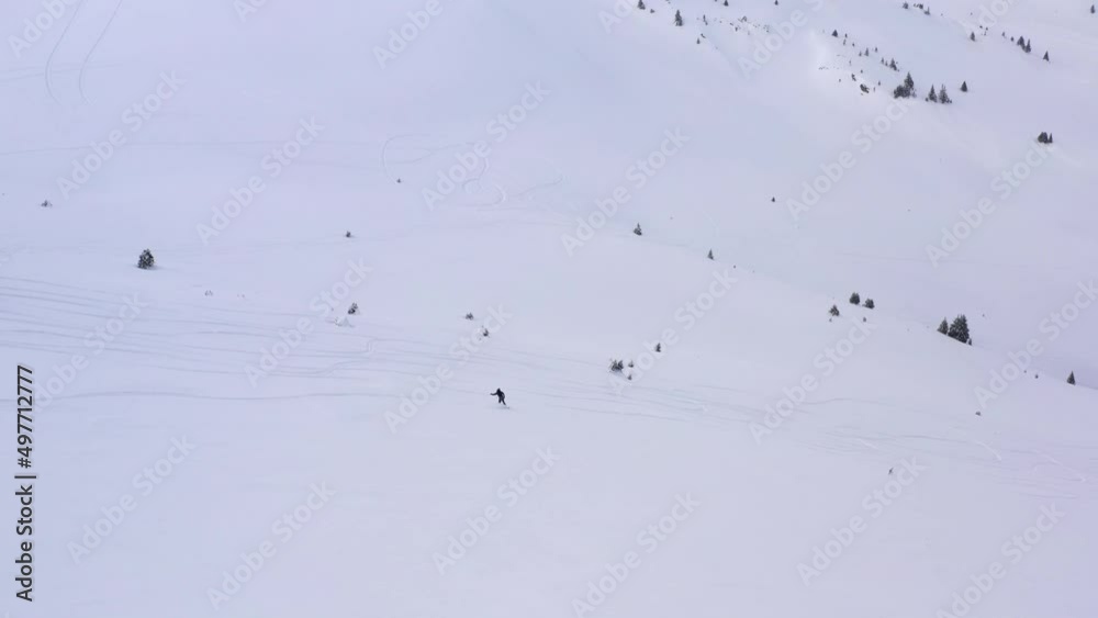 Drone 4k video with ski touring skiers in Bucegi Mountains on a beautiful sunny day skiing in powder snow Drone 4k video with ski touring skiers in Bucegi Mountains on a beautiful sunny day skiing in powder snow