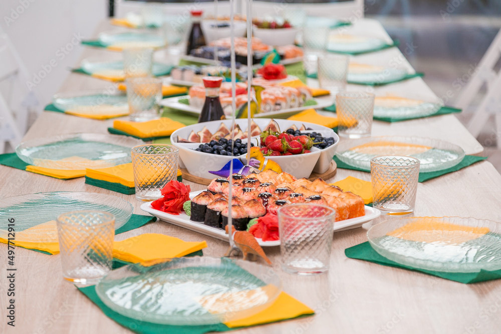 Decorated catering banquet table with different food appetizers assortment on a party