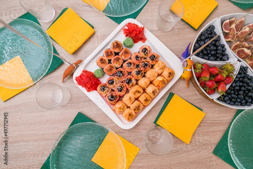 Decorated catering banquet table with different food appetizers assortment on a party photo