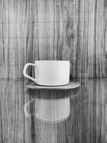 Black and white photo of an empty coffee cup