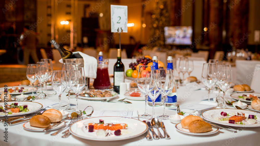 Decorated catering banquet table with different food appetizers assortment on a party