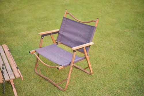 Camping chair on green grass.