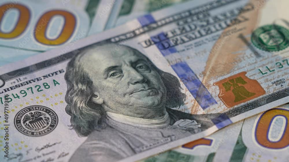 Benjamin Franklin Face On One Hundred Dollar Notes Macro Shot. 100 USA Dollars Banknotes Symbol Of Rich Business Economy of USA. American Dollars Cash Money. Macro shot Benjamin Franklin Face On One Hundred Dollar Notes Macro Shot. 100 USA Dollars Banknotes Symbol Of Rich Business Economy of USA. American Dollars Cash Money. Macro shot
