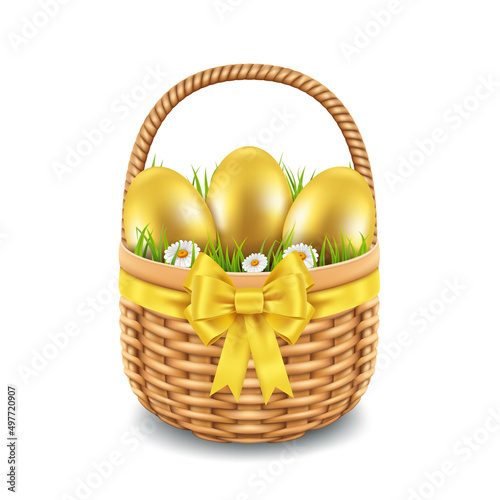 Wicker basket with golden eggs, grass and yellow bow on white background, spring holiday Easter.