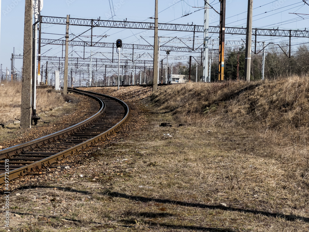 Side, single railroad track, with electric traction.
