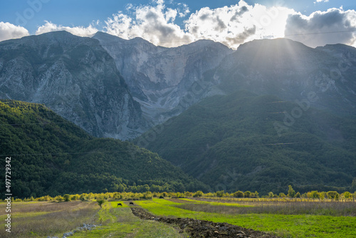 Beautiful mountain valley with gentle hills and agricultutal filds